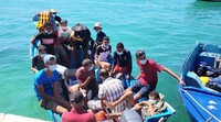 Des migrants tunisiens arrivent à Lampedusa, en août 2020. Crédit : Ansa